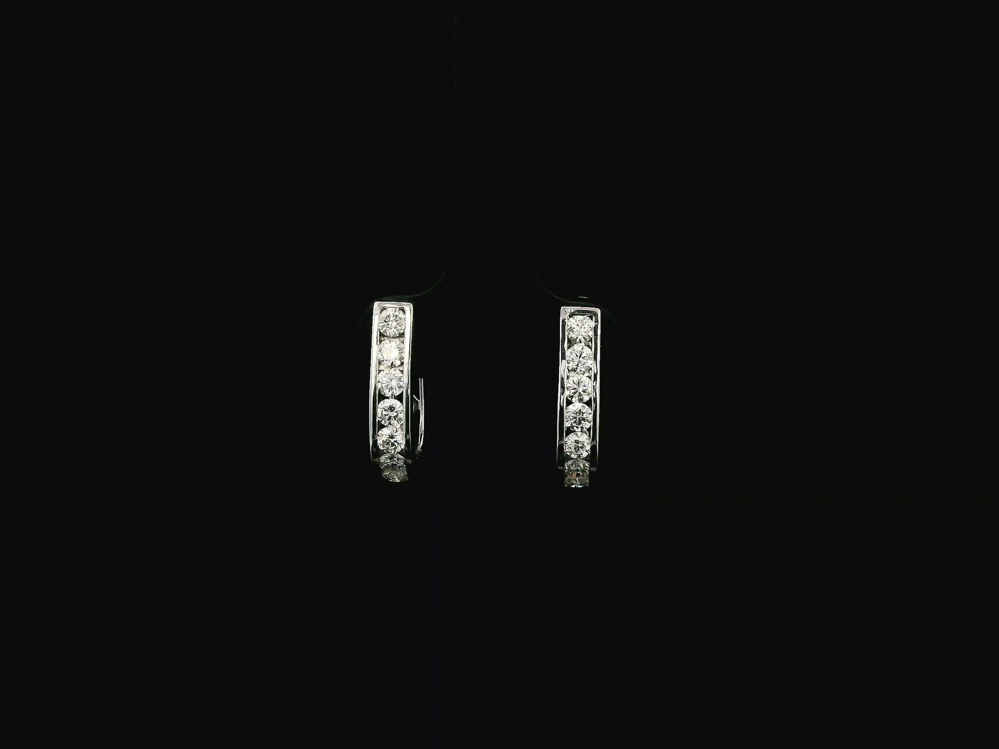 Diamond hoop earrings in 18K white gold featuring 0.98 carats of diamonds by Emirates Diamonds.