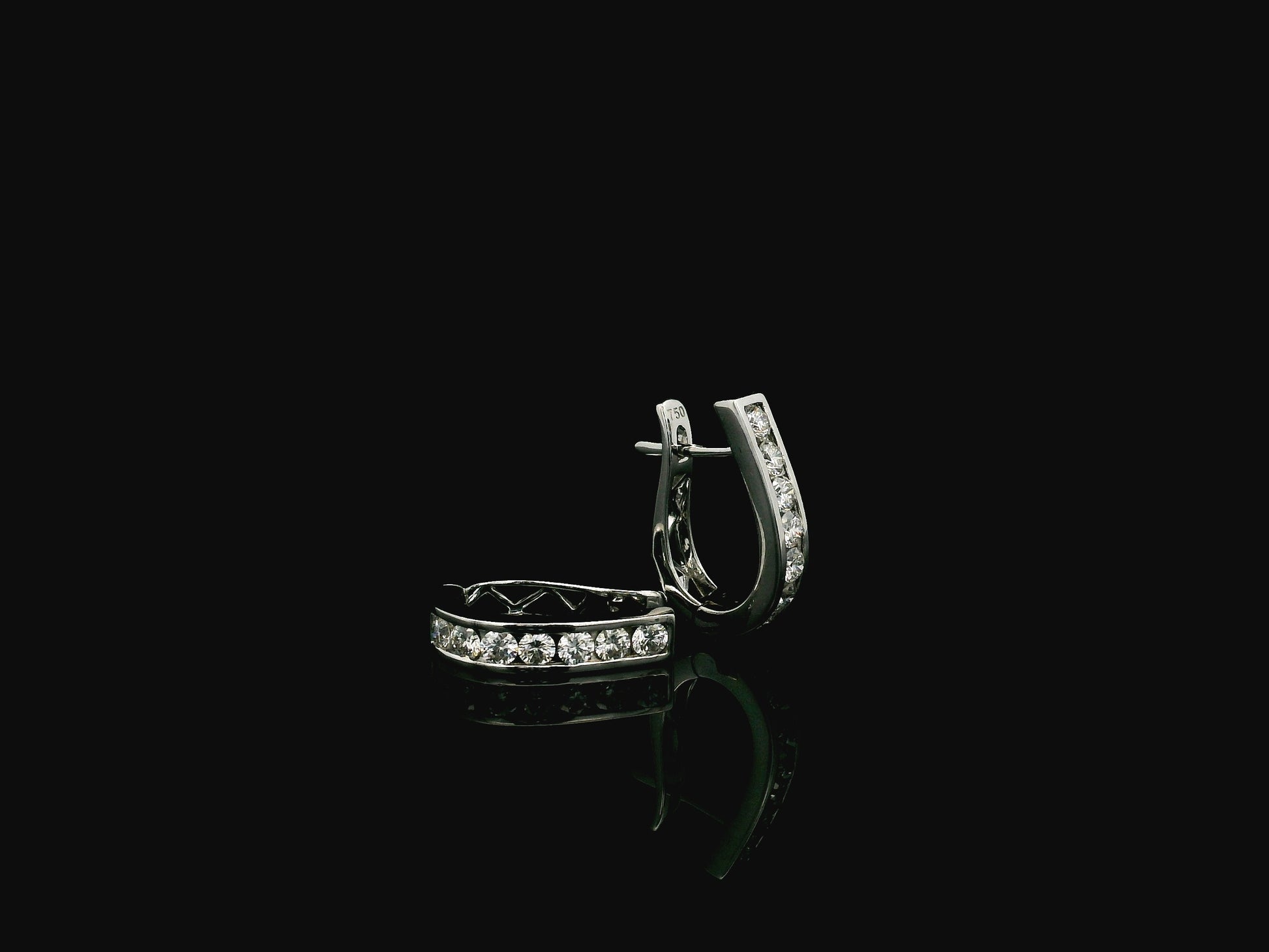 Diamond hoop earrings in 18K white gold featuring 0.98 carats of diamonds by Emirates Diamonds.