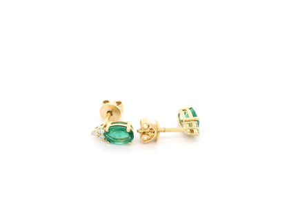 Emerald and diamond drop earrings in 18K yellow gold featuring 0.78 carat emeralds and 0.07 carat diamonds by Emirates Diamonds.
