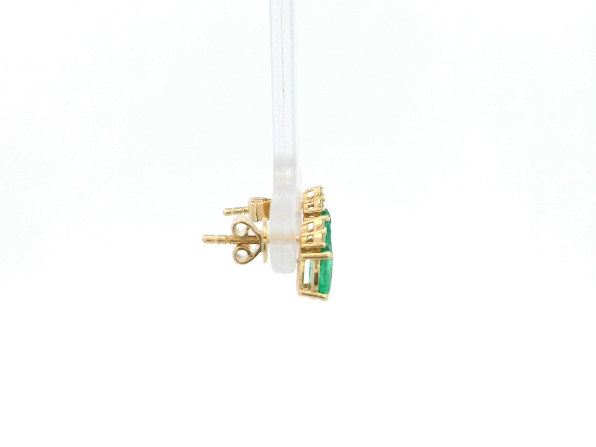 Emerald and diamond drop earrings in 18K yellow gold featuring 0.78 carat emeralds and 0.07 carat diamonds by Emirates Diamonds.