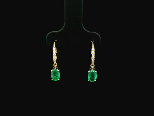 Emerald drop hoop earrings in 18K yellow gold with 0.95 carat emeralds and 0.09 carat diamond pavé hoops by Emirates Diamonds.