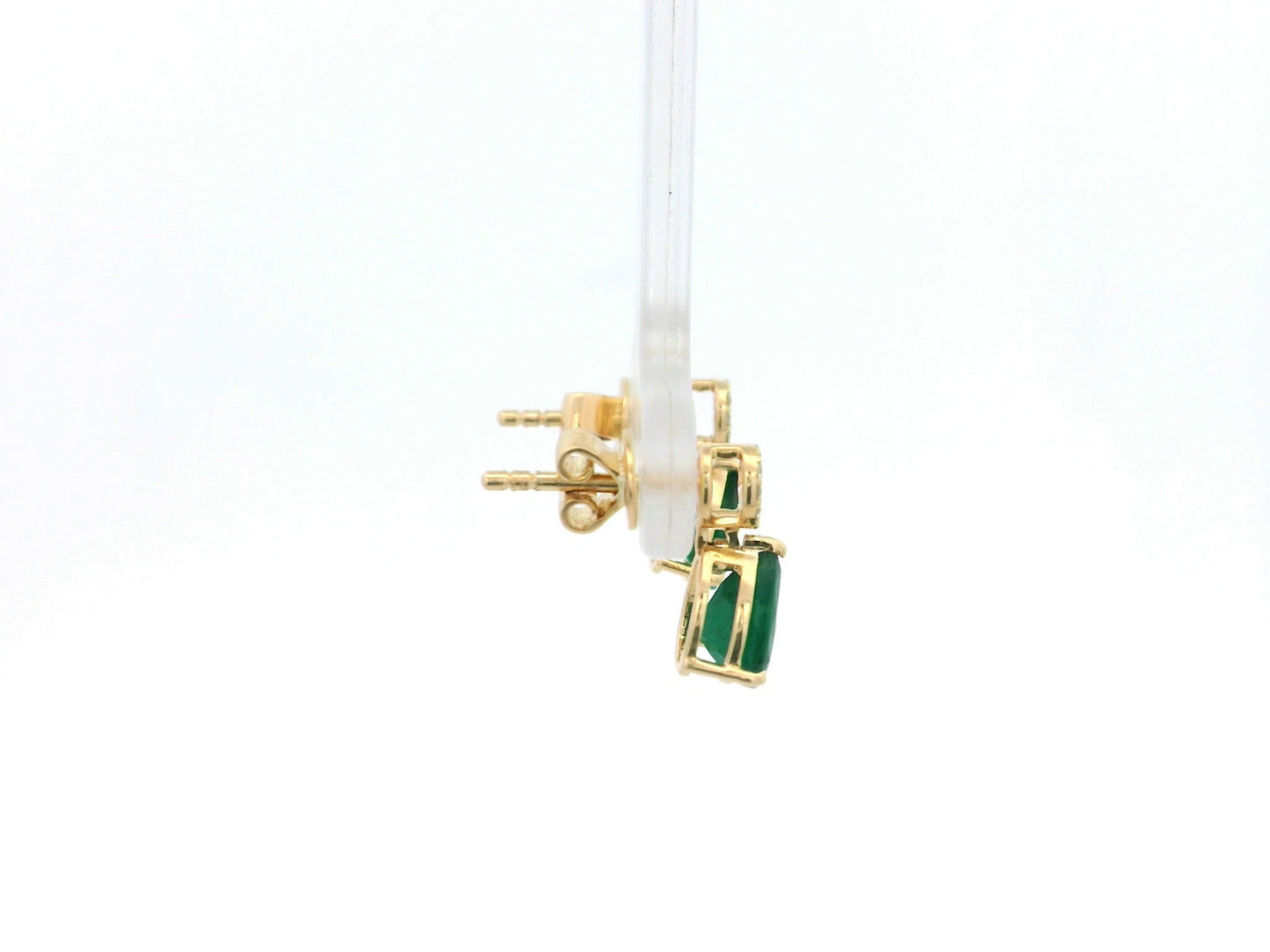 Pear emerald and diamond drop earrings in 18K yellow gold featuring 1.27 carat emeralds and 0.07 carat diamonds by Emirates Diamonds.