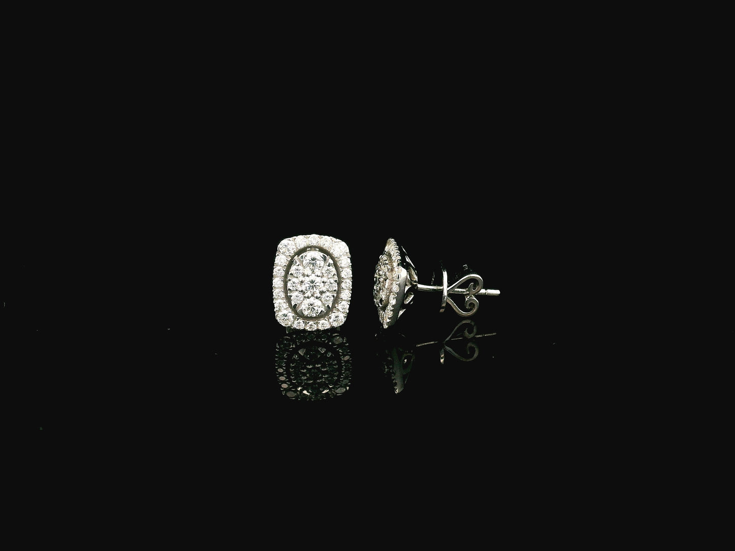 18K white gold diamond halo stud earrings featuring round brilliant diamonds with cushion halo design and 0.64 carat total diamond weight