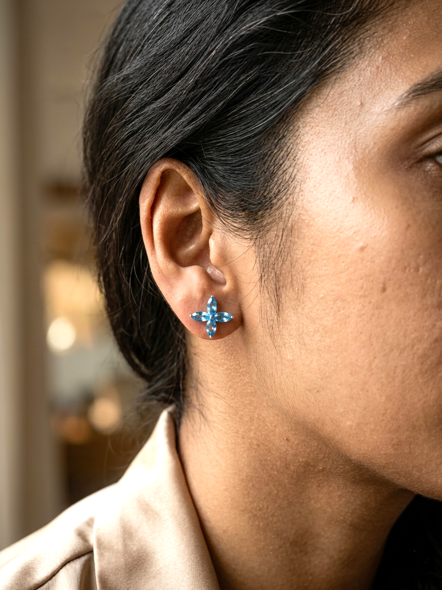 Blue topaz floral stud earrings in 18K white gold with marquise cut stones