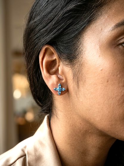 Blue topaz floral stud earrings in 18K white gold with marquise cut stones