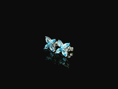 Blue topaz floral stud earrings in 18K white gold with marquise cut stones