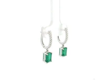 Emerald cut emerald drop earrings with diamond hoops in 18K white gold