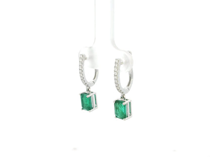 Emerald cut emerald drop earrings with diamond hoops in 18K white gold