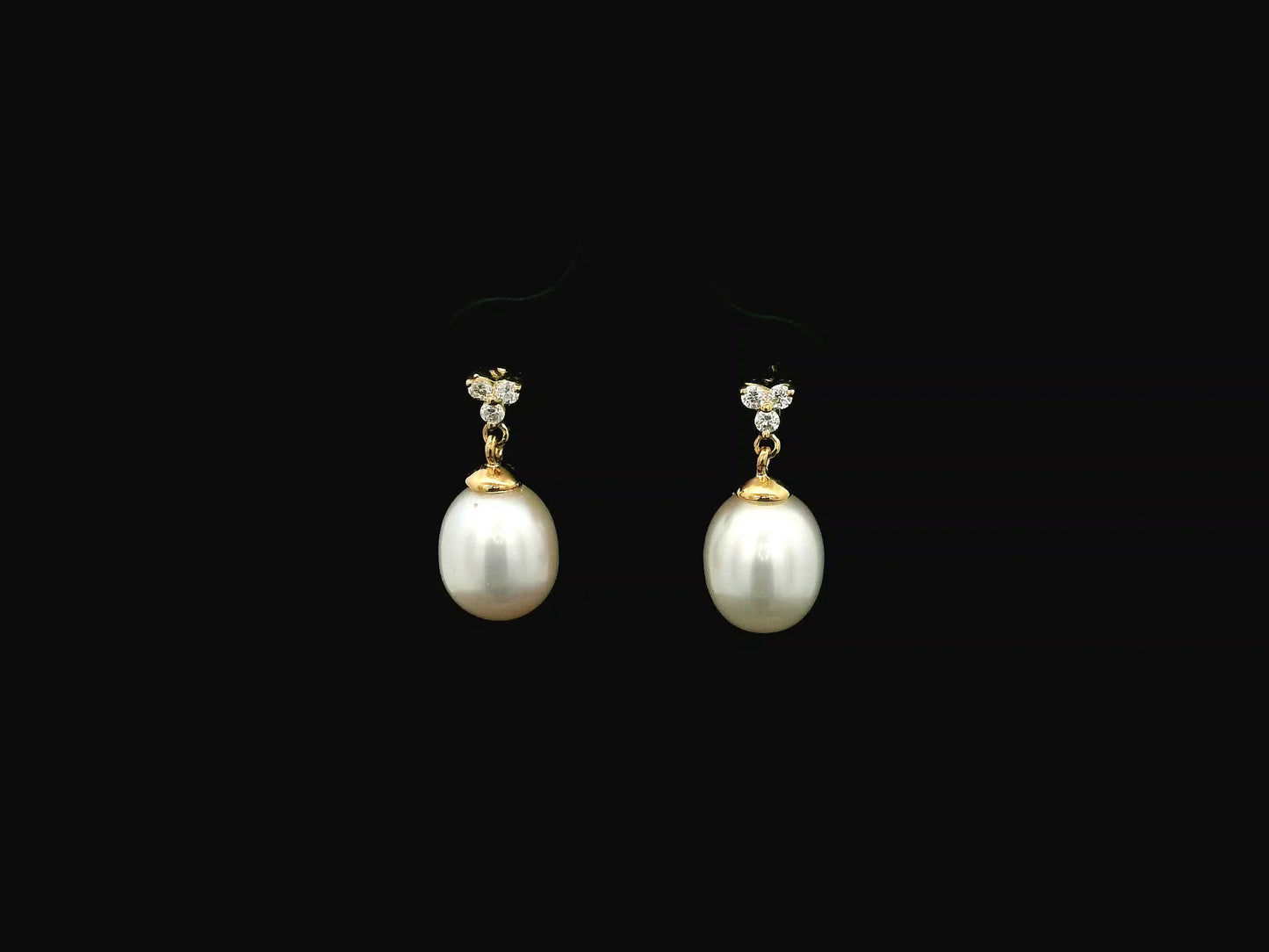 White pearl drop earrings with diamond accents in 18K yellow gold