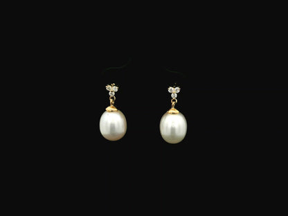 White pearl drop earrings with diamond accents in 18K yellow gold