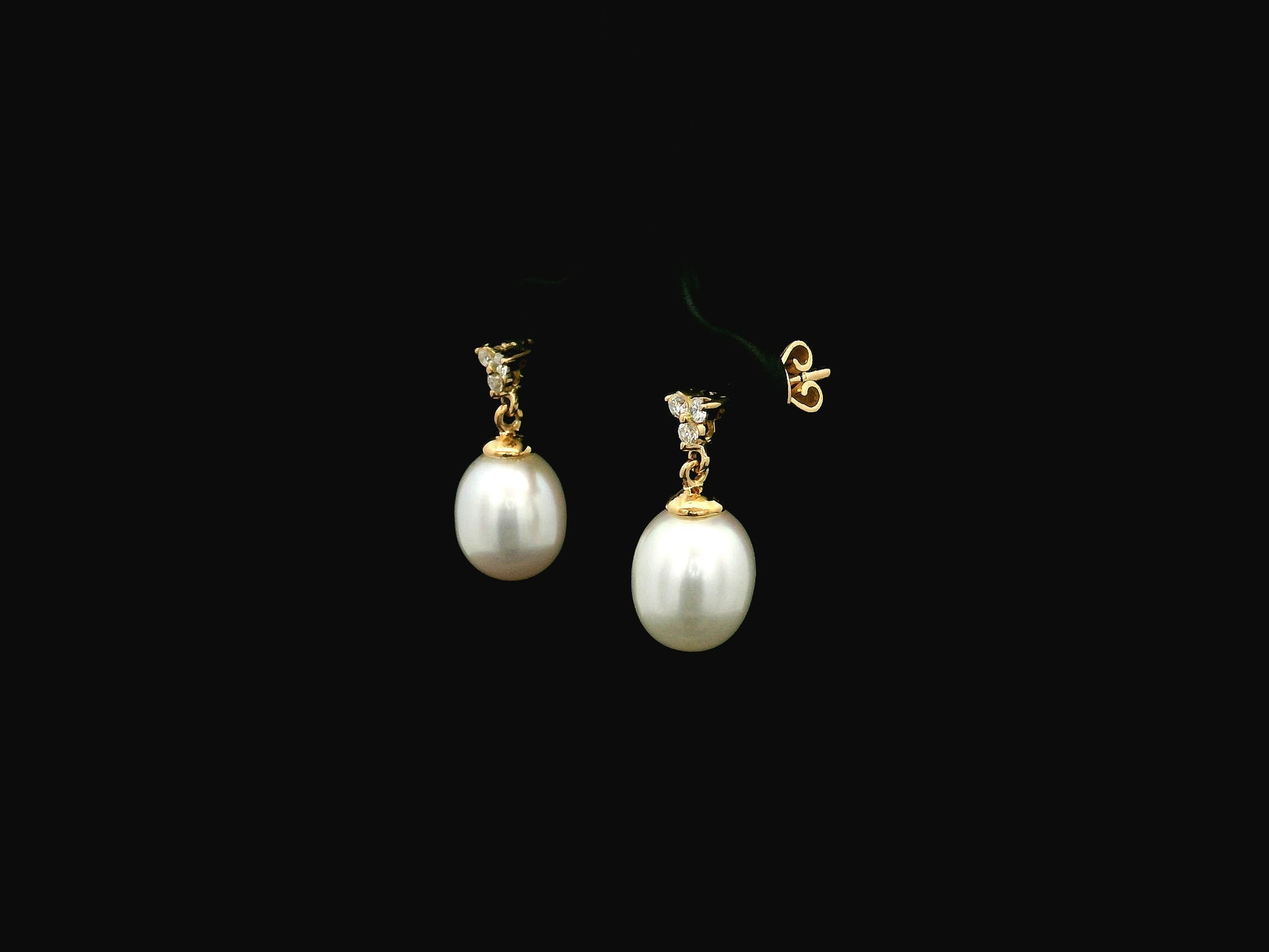 White pearl drop earrings with diamond accents in 18K yellow gold