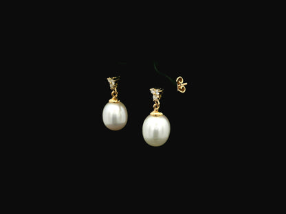 White pearl drop earrings with diamond accents in 18K yellow gold