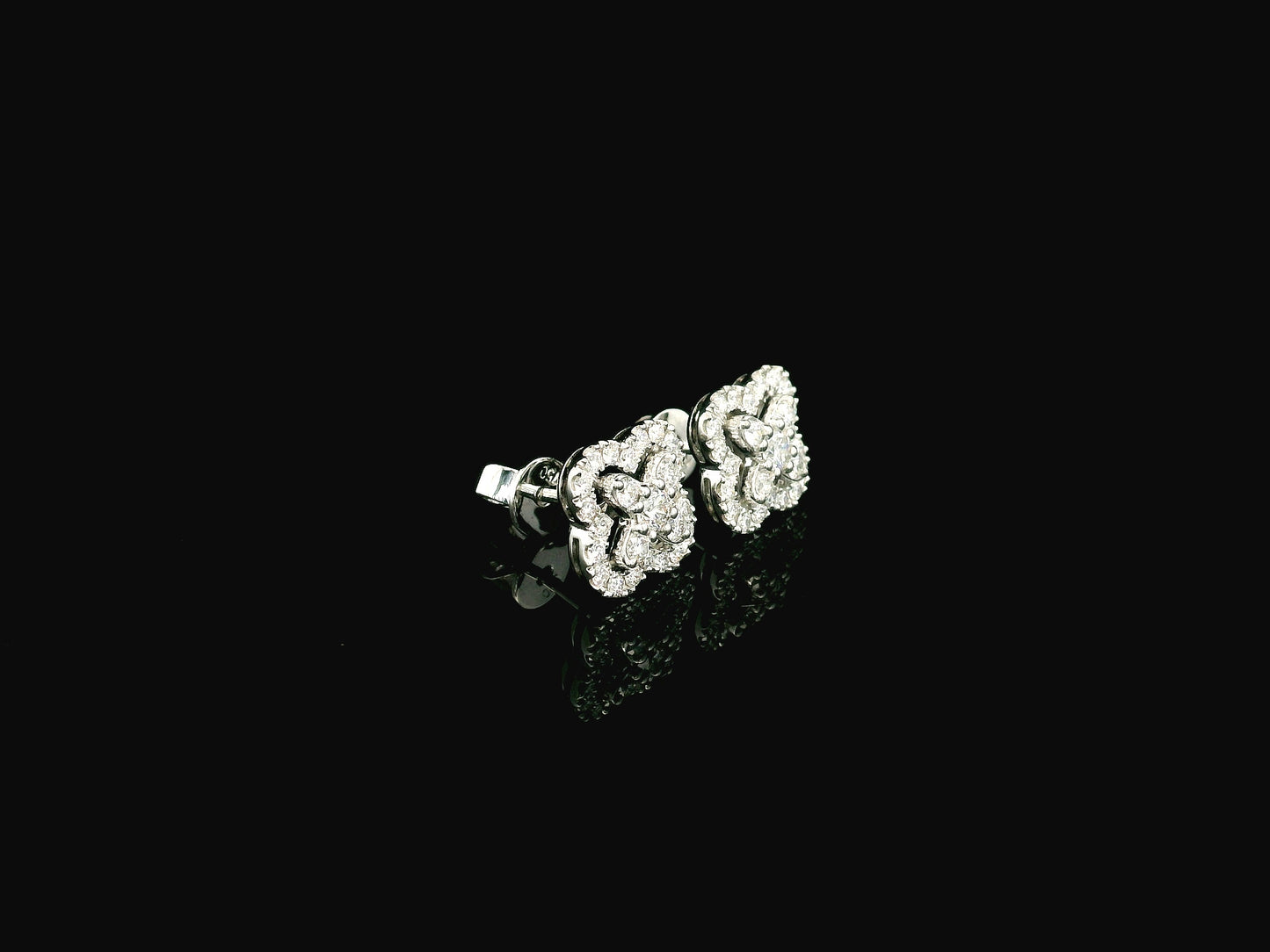 Diamond floral cluster stud earrings in 18K white gold by Emirates Diamonds