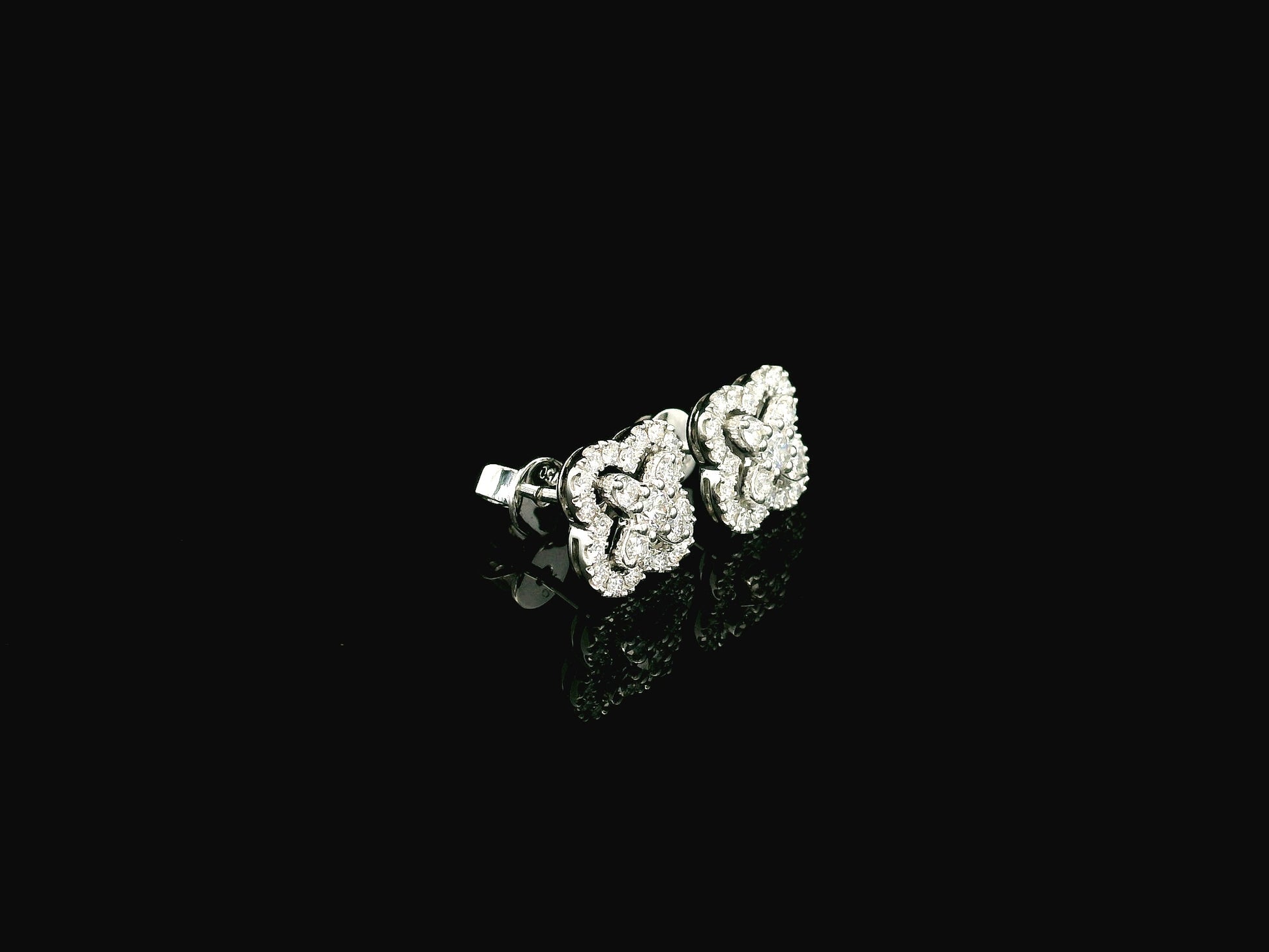 Diamond floral cluster stud earrings in 18K white gold by Emirates Diamonds
