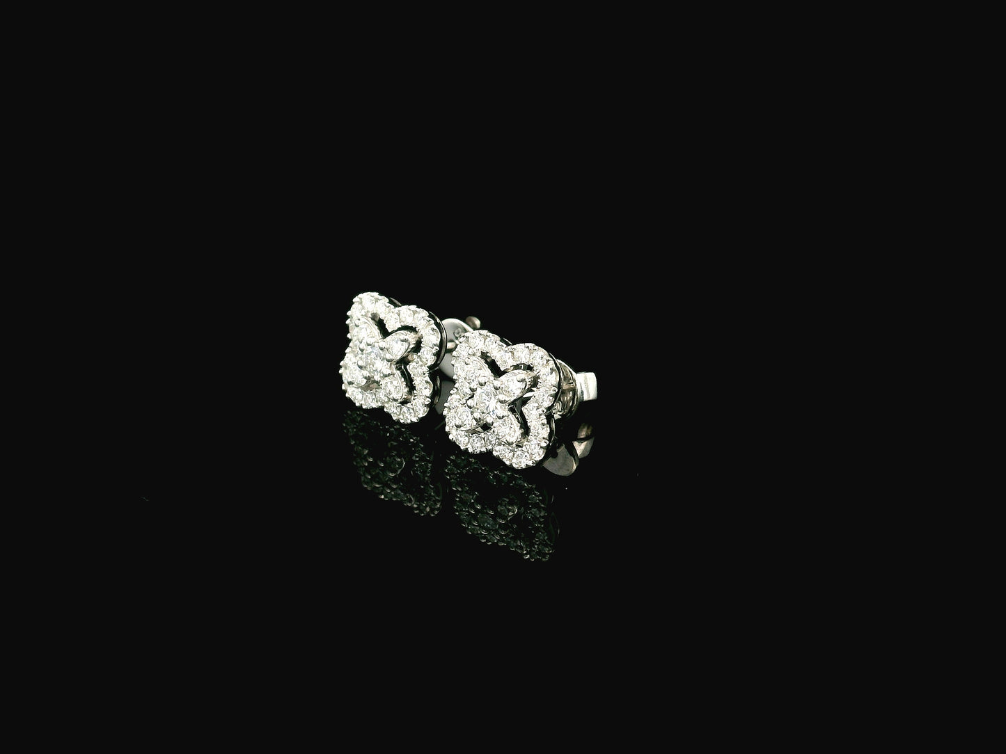 Diamond floral cluster stud earrings in 18K white gold by Emirates Diamonds