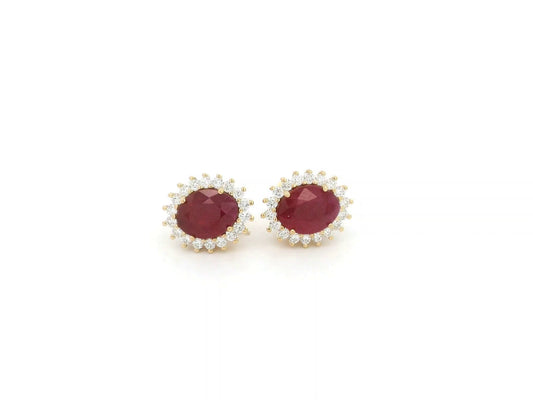 Ruby and diamond halo stud earrings in 18K yellow gold by Emirates Diamonds