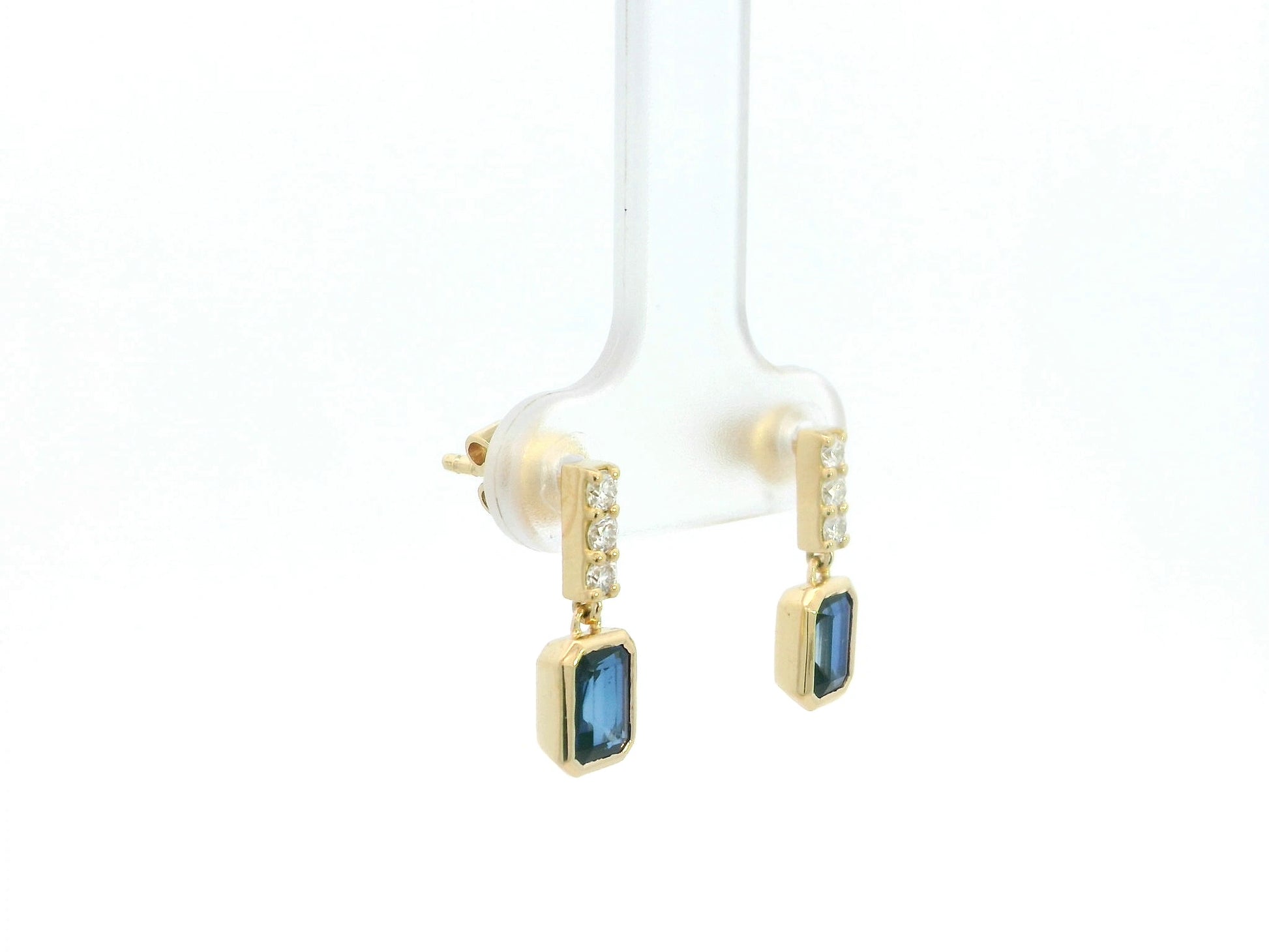 Blue sapphire and diamond drop earrings in 18K yellow gold emerald cut sapphire design