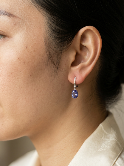 18K white gold tanzanite drop earrings with oval tanzanites and diamond accents