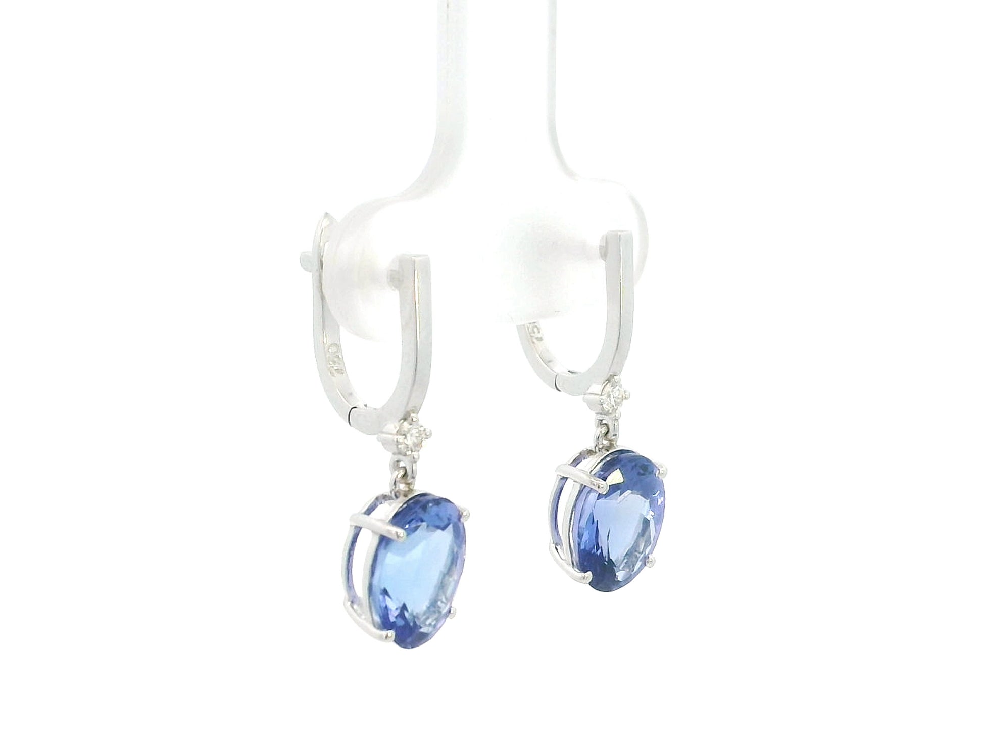 18K white gold tanzanite drop earrings with oval tanzanites and diamond accents