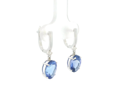 18K white gold tanzanite drop earrings with oval tanzanites and diamond accents