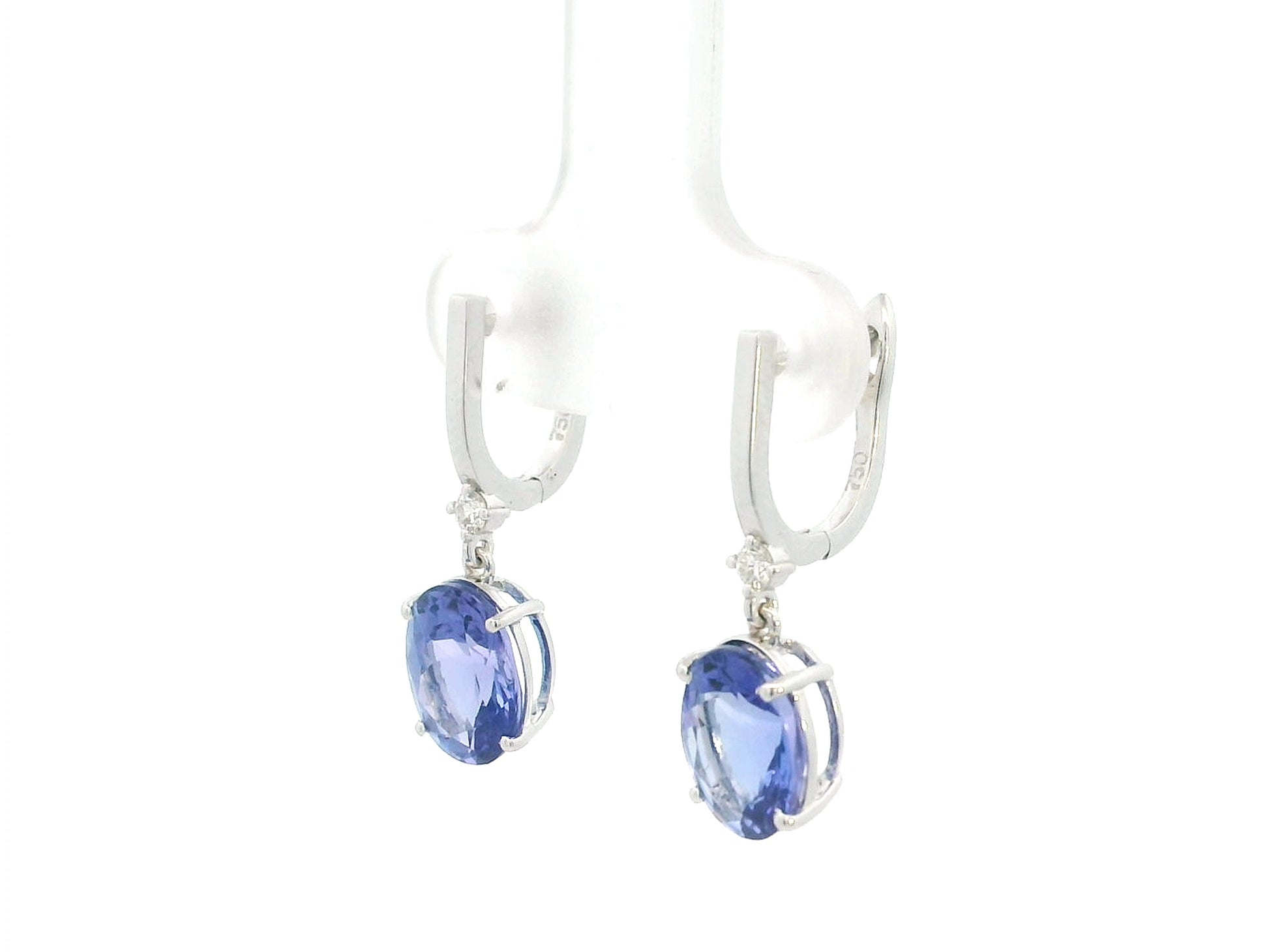 18K white gold tanzanite drop earrings with oval tanzanites and diamond accents