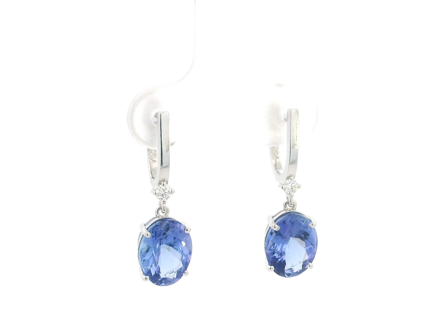18K white gold tanzanite drop earrings with oval tanzanites and diamond accents