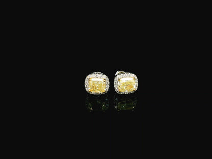 18K white gold fancy yellow cushion cut diamond halo stud earrings with GIA certified VS1 diamonds
