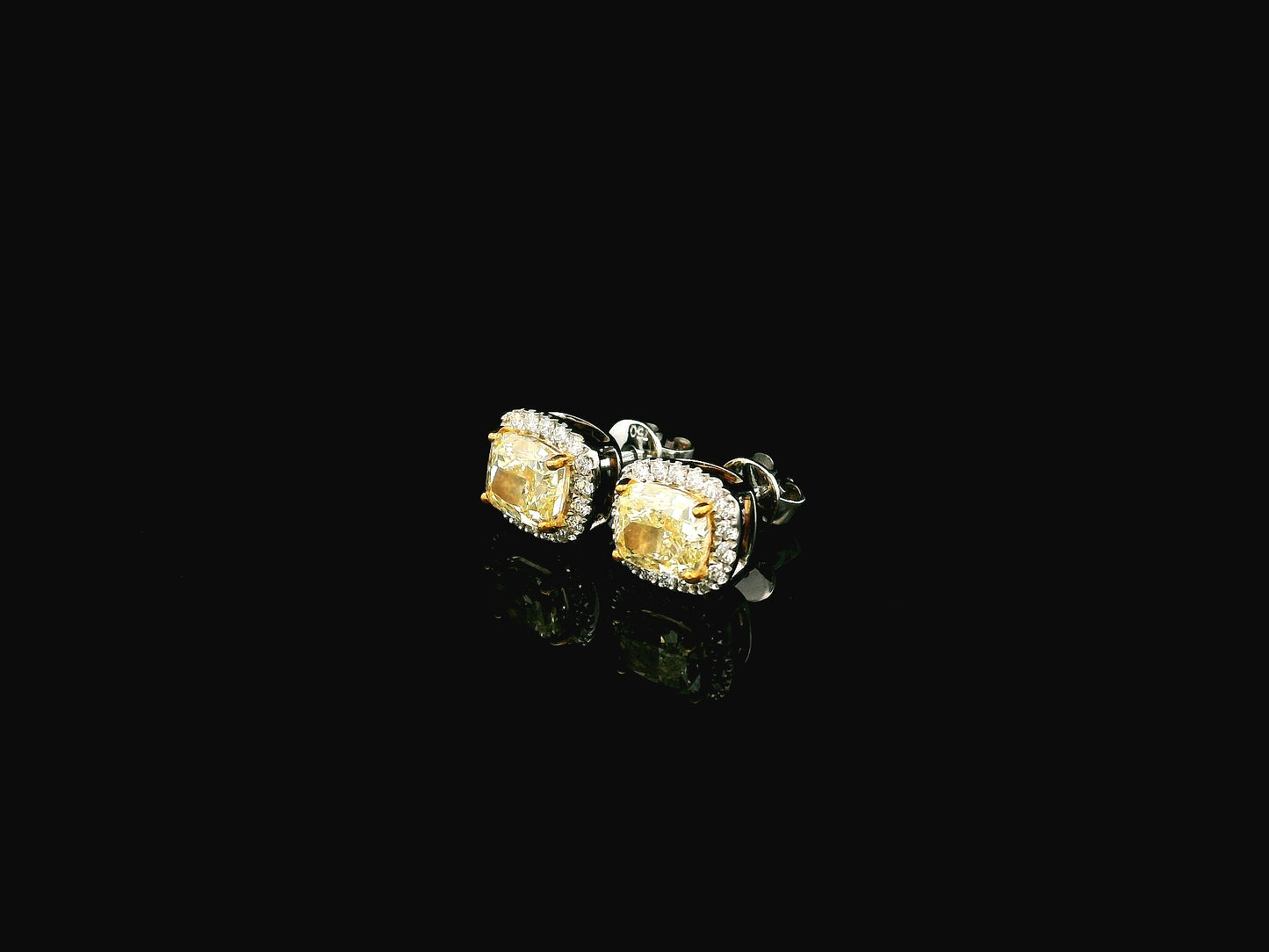 18K white gold fancy yellow cushion cut diamond halo stud earrings with GIA certified VS1 diamonds