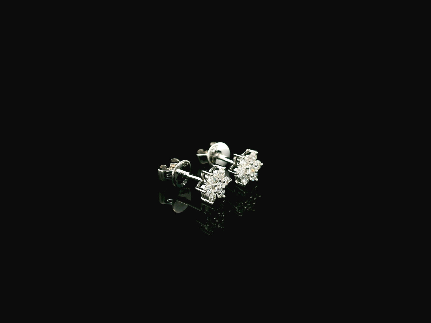 Diamond flower cluster stud earrings in 18K white gold by Emirates Diamonds