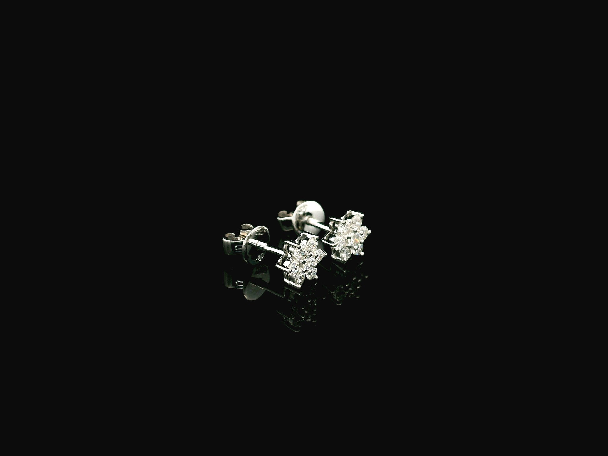Diamond flower cluster stud earrings in 18K white gold by Emirates Diamonds