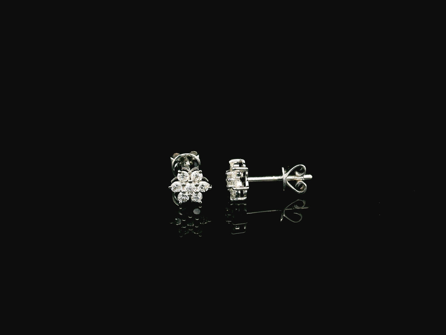 Diamond flower cluster stud earrings in 18K white gold by Emirates Diamonds