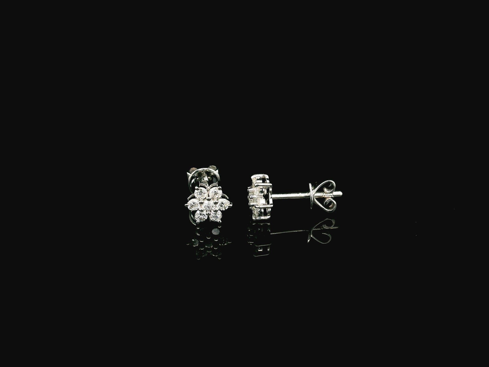 Diamond flower cluster stud earrings in 18K white gold by Emirates Diamonds