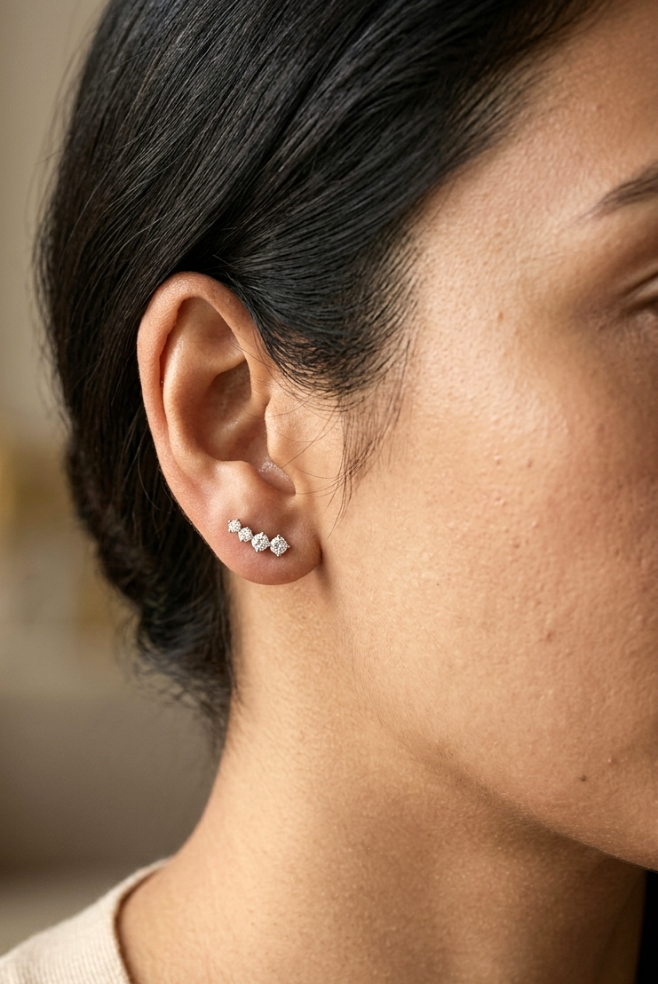 Graduated natural diamond drop earrings in 18K white gold, 0.55 carat total diamond weight.