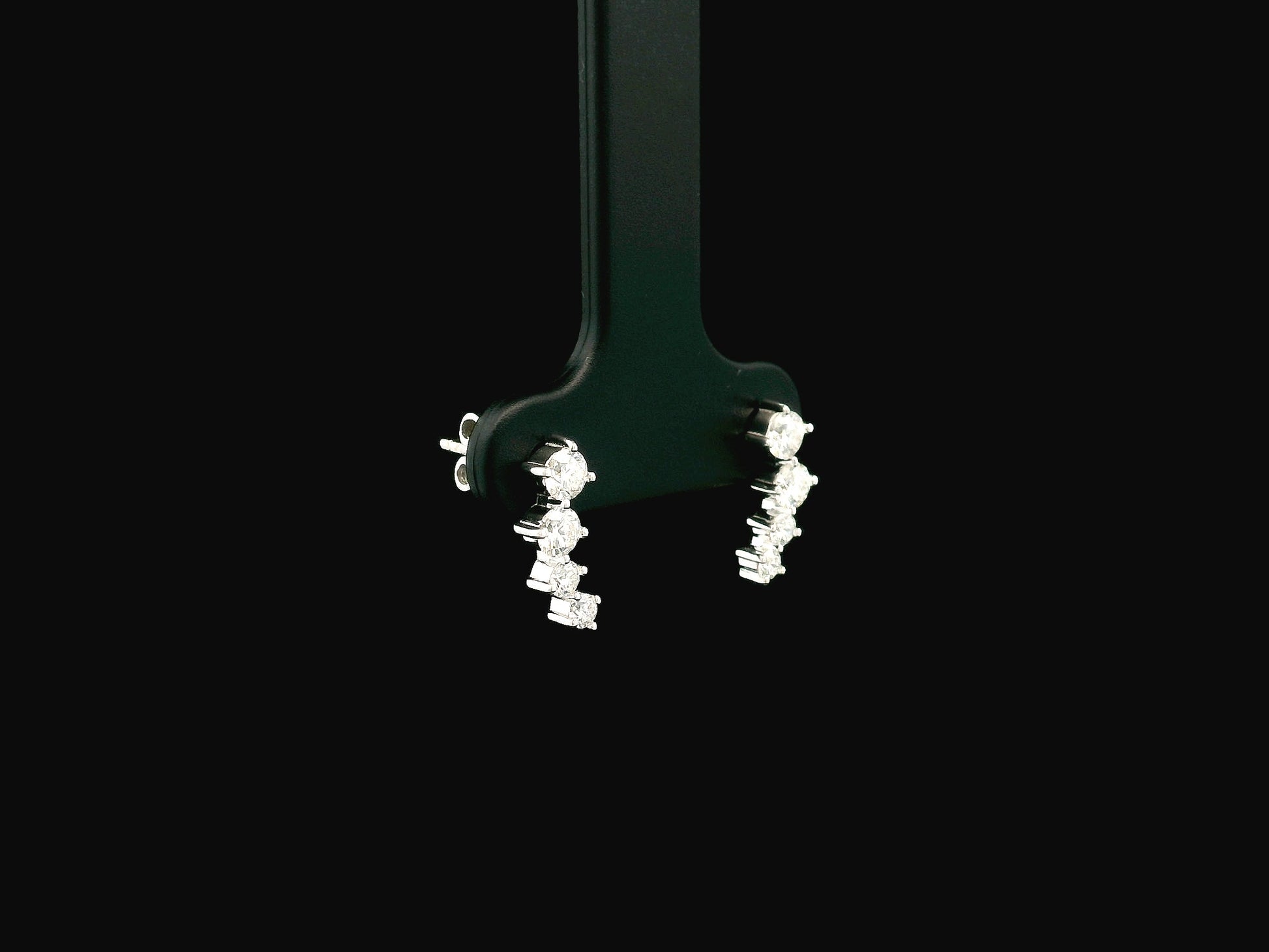 Graduated natural diamond drop earrings in 18K white gold, 0.55 carat total diamond weight.