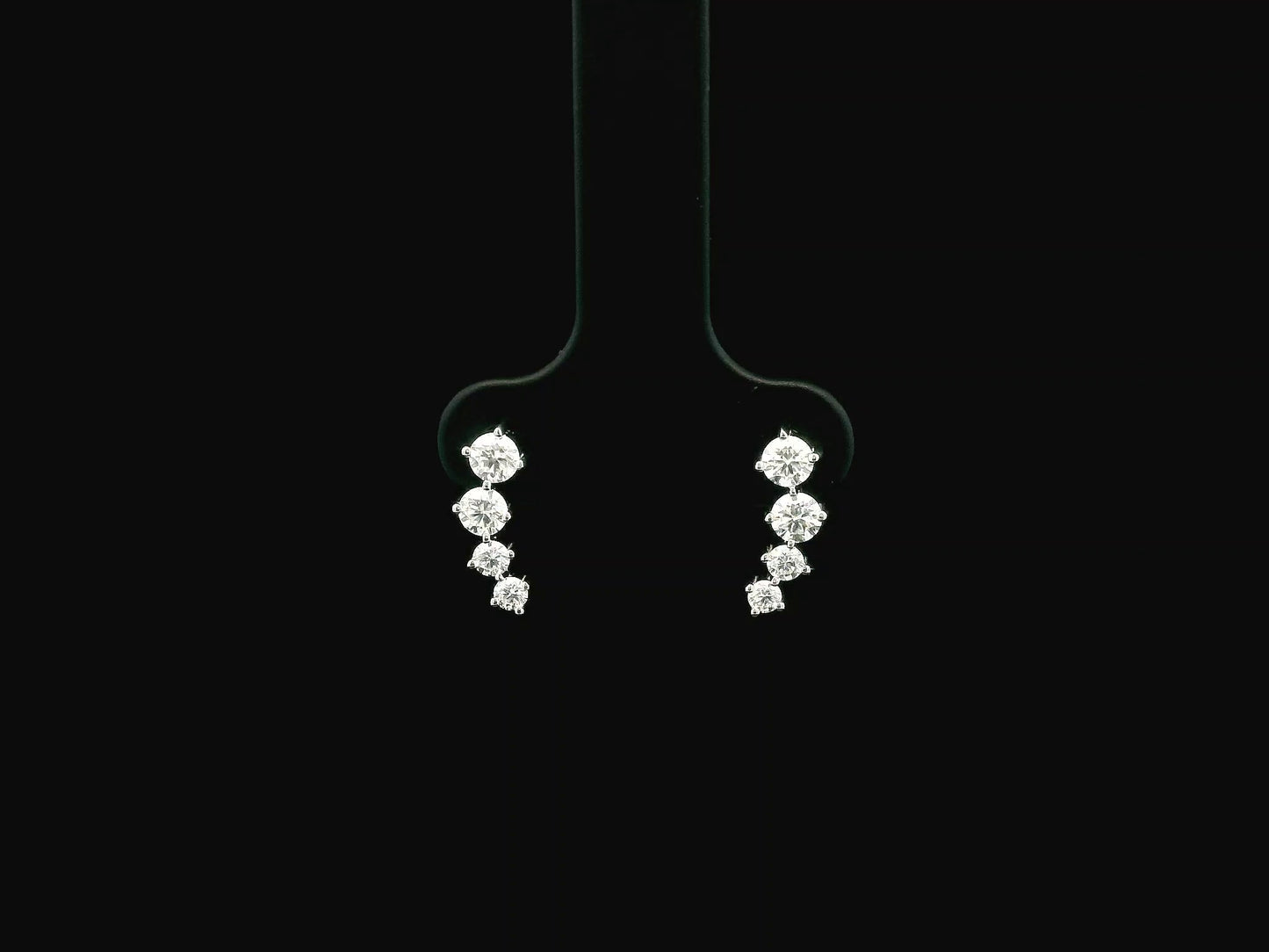 Graduated natural diamond drop earrings in 18K white gold, 0.55 carat total diamond weight.