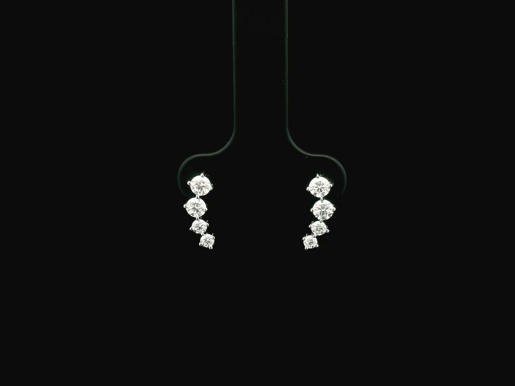 Graduated natural diamond drop earrings in 18K white gold, 0.55 carat total diamond weight.