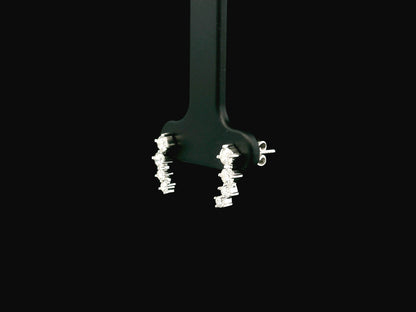 Graduated natural diamond drop earrings in 18K white gold, 0.55 carat total diamond weight.