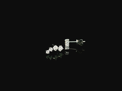 Graduated natural diamond drop earrings in 18K white gold, 0.55 carat total diamond weight.