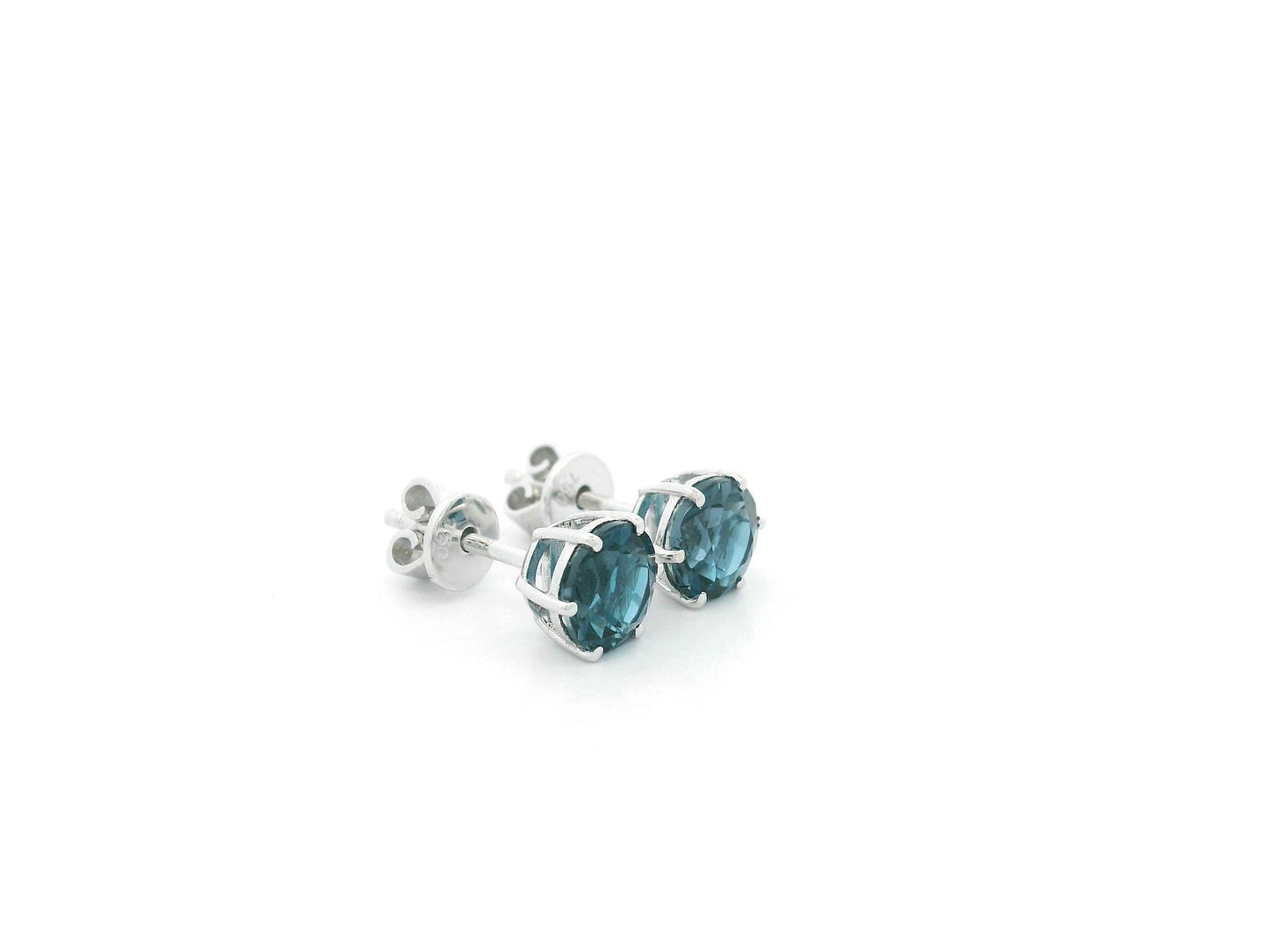 London Blue Topaz solitaire stud earrings in 18K white gold featuring 1.90 carats of natural round London Blue Topaz.