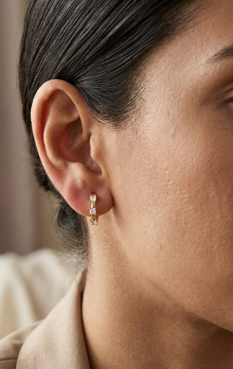 18K yellow gold diamond hoop earrings with round brilliant diamonds totaling 0.36 carat