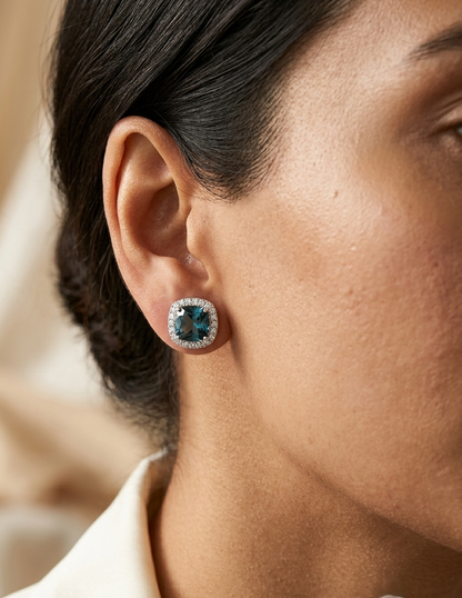 London Blue Topaz halo stud earrings in 18K white gold with natural diamond halo surround