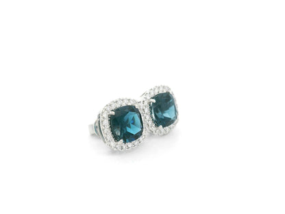 London Blue Topaz halo stud earrings in 18K white gold with natural diamond halo surround