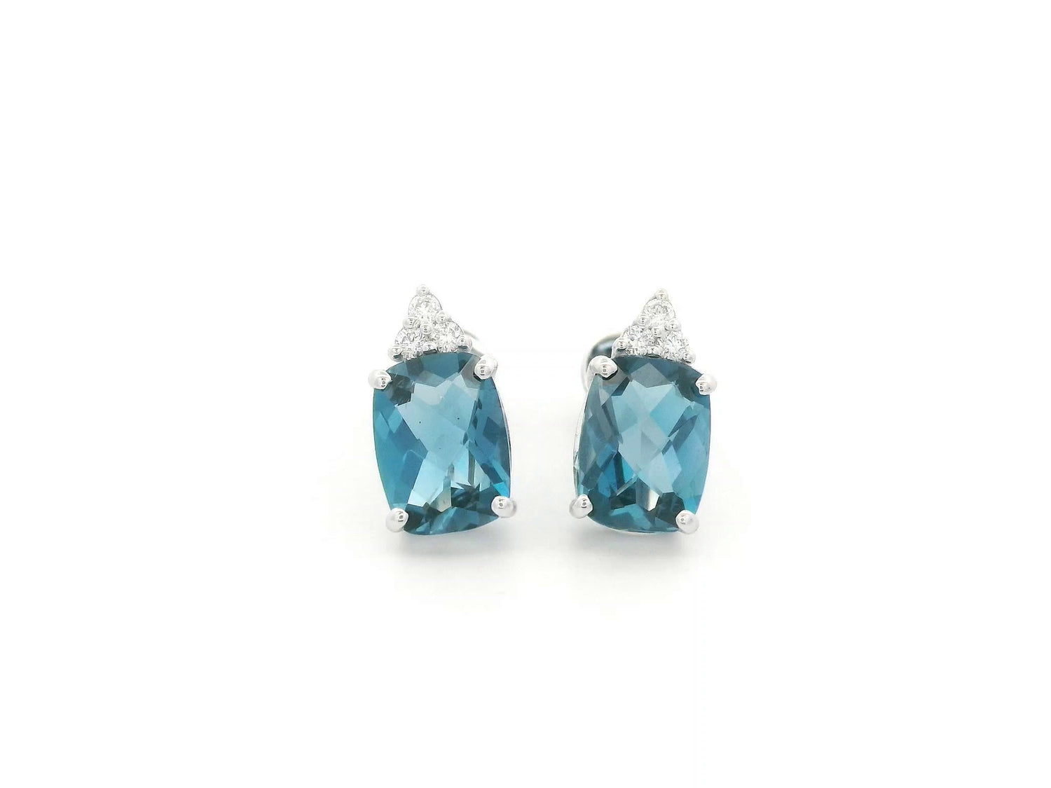 18K white gold London Blue Topaz stud earrings featuring 2.94 carats of cushion cut London Blue Topaz with diamond accents