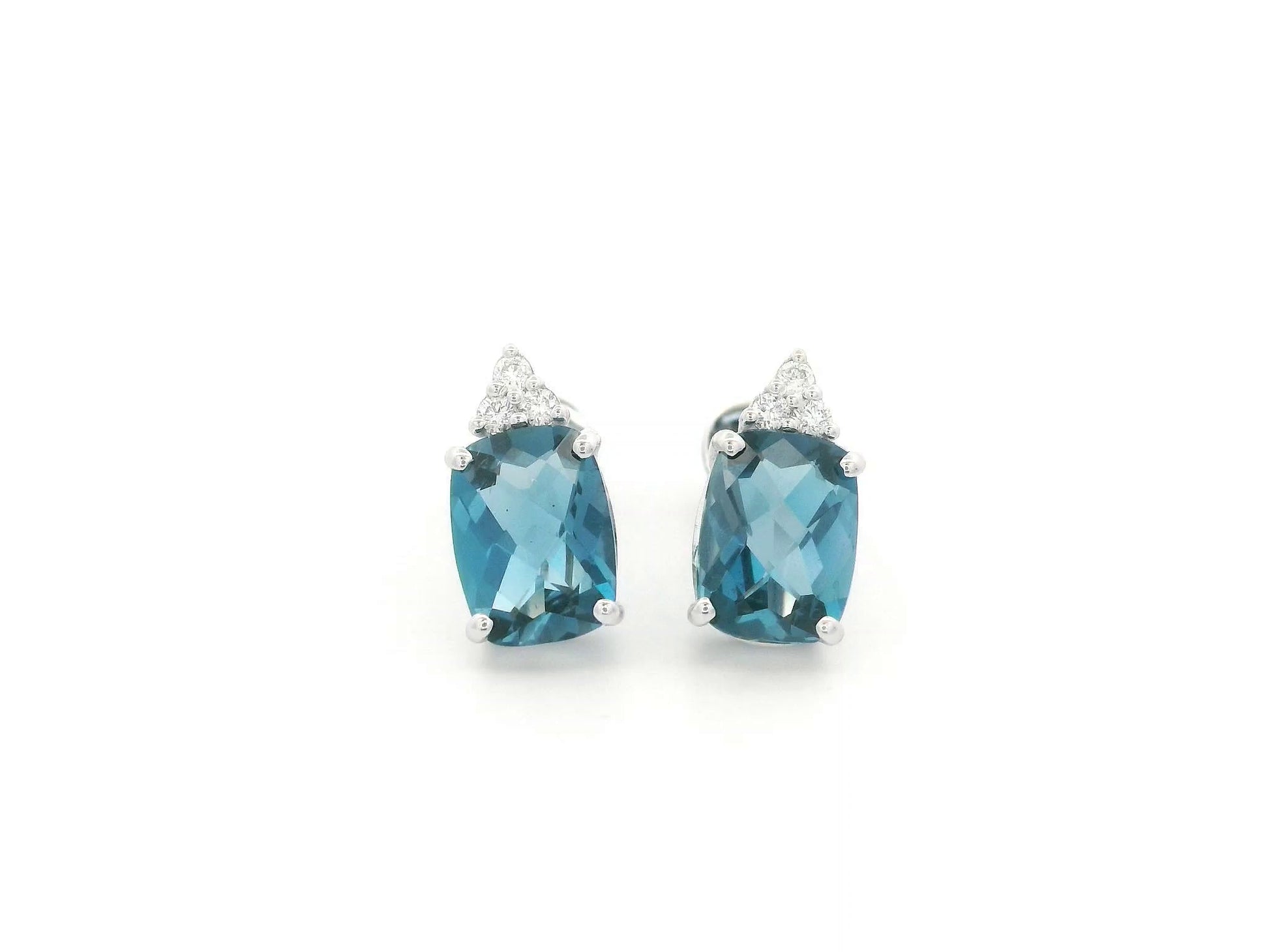 18K white gold London Blue Topaz stud earrings featuring 2.94 carats of cushion cut London Blue Topaz with diamond accents