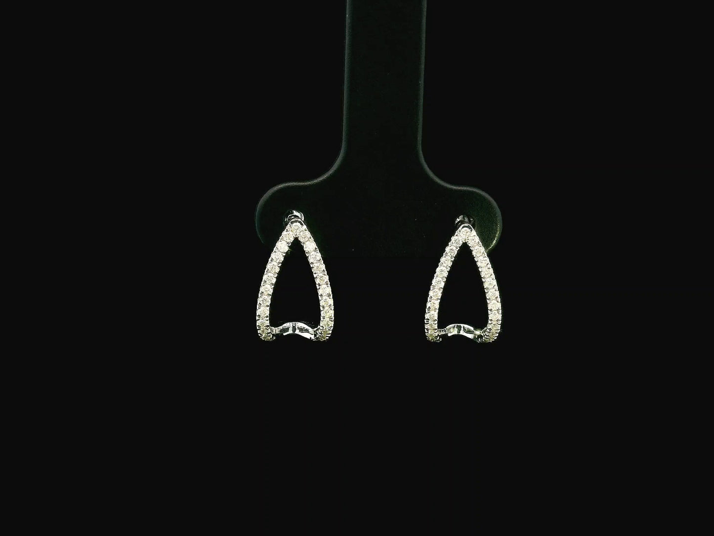18K white gold diamond teardrop earrings featuring 0.25 carat natural diamonds in an elegant open teardrop design with butterfly push back closures.