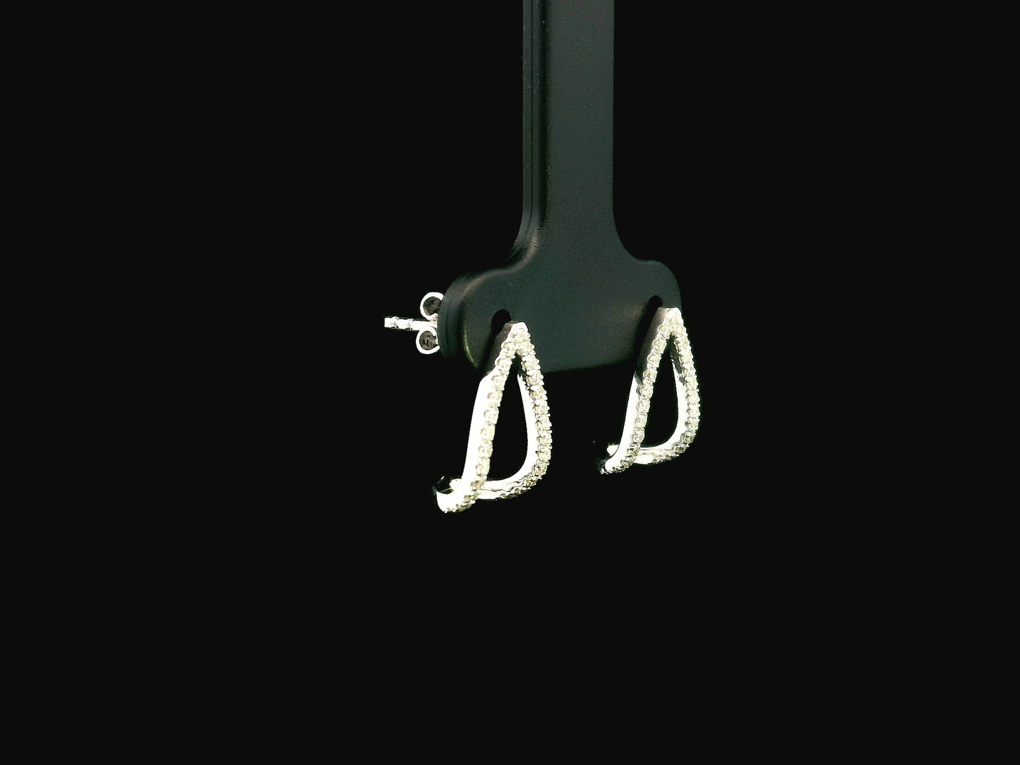 18K white gold diamond teardrop earrings featuring 0.25 carat natural diamonds in an elegant open teardrop design with butterfly push back closures.