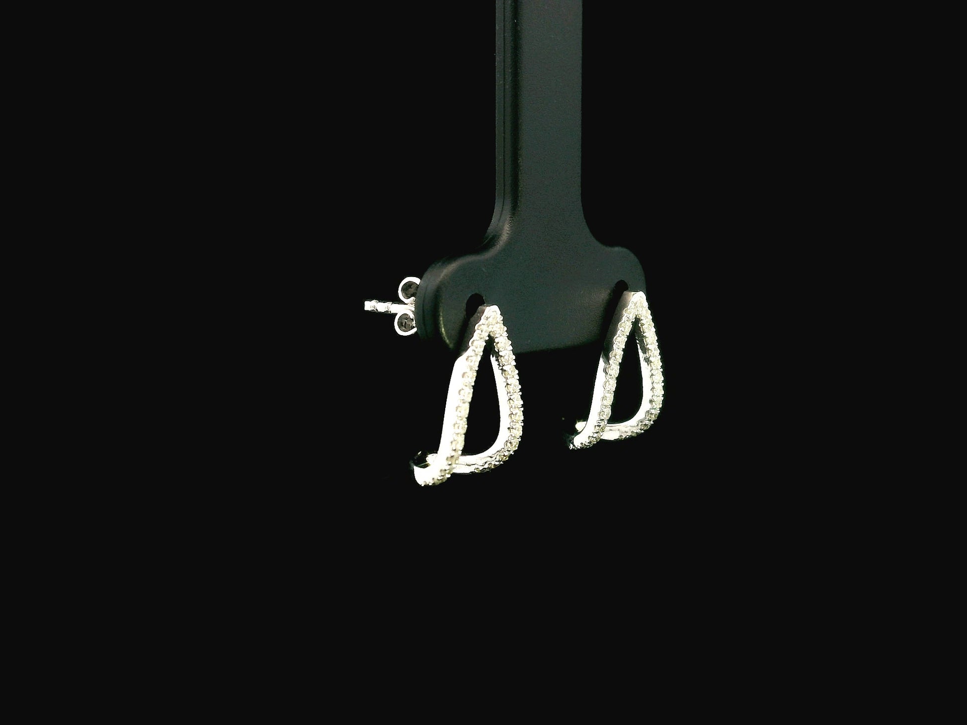 18K white gold diamond teardrop earrings featuring 0.25 carat natural diamonds in an elegant open teardrop design with butterfly push back closures.