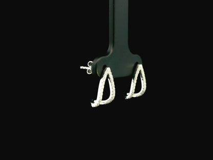 18K white gold diamond teardrop earrings featuring 0.25 carat natural diamonds in an elegant open teardrop design with butterfly push back closures.