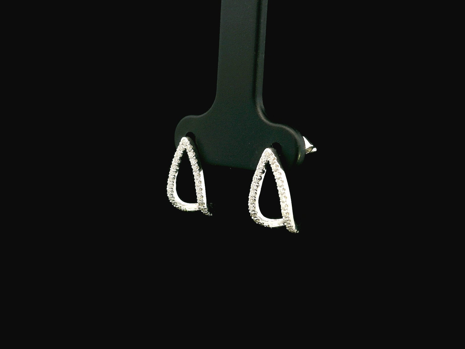 18K white gold diamond teardrop earrings featuring 0.25 carat natural diamonds in an elegant open teardrop design with butterfly push back closures.
