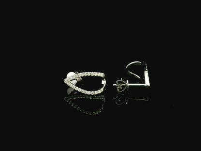 18K white gold diamond teardrop earrings featuring 0.25 carat natural diamonds in an elegant open teardrop design with butterfly push back closures.